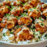 HONEY GARLIC CHICKEN BITES OVER CREAMY RICE